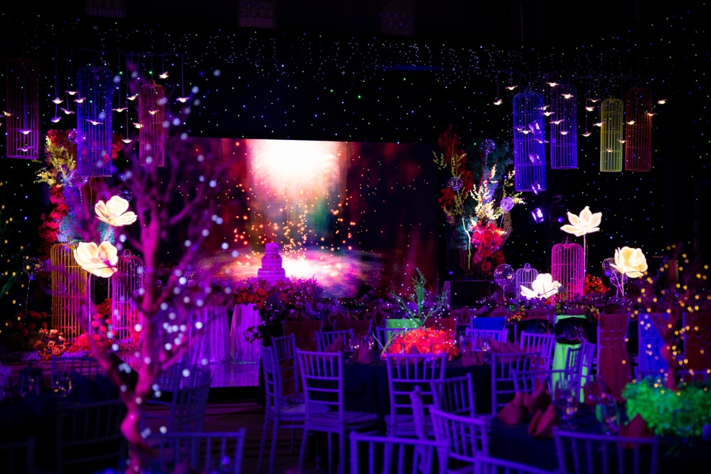 Reception stage floral backdrop at Rayong Marriott Resort & Spa, Rayong, planned and decorated by Niramit Creations