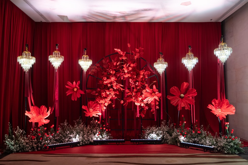 Sangeet stage floral backdrop at Rayong Marriott Resort & Spa, Rayong, planned and decorated by Niramit Creations