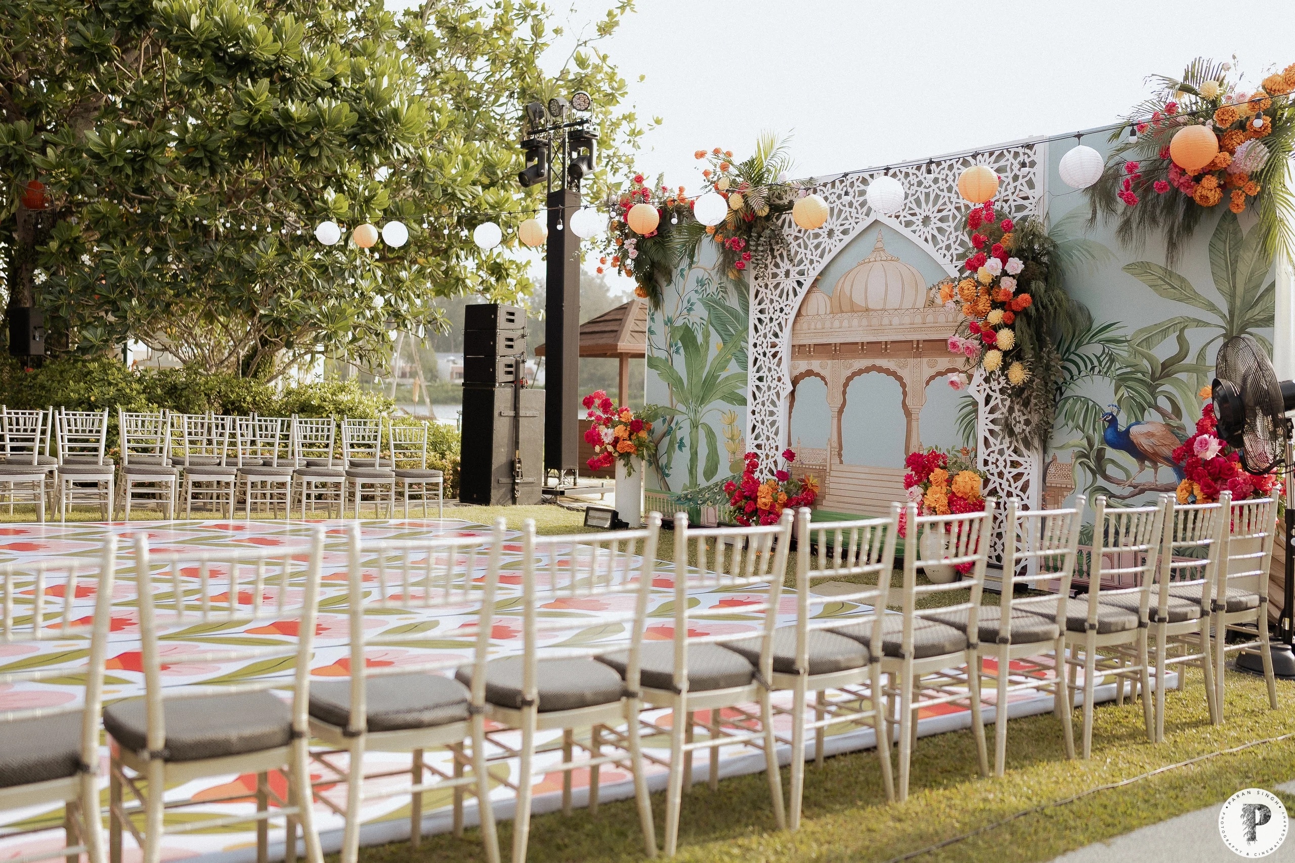 Sangeet & Mehndi mehndi floral stage decor at an Indian wedding at Angsana Laguna Phuket, Phuket, Thailand — planned by Niramit Creations.