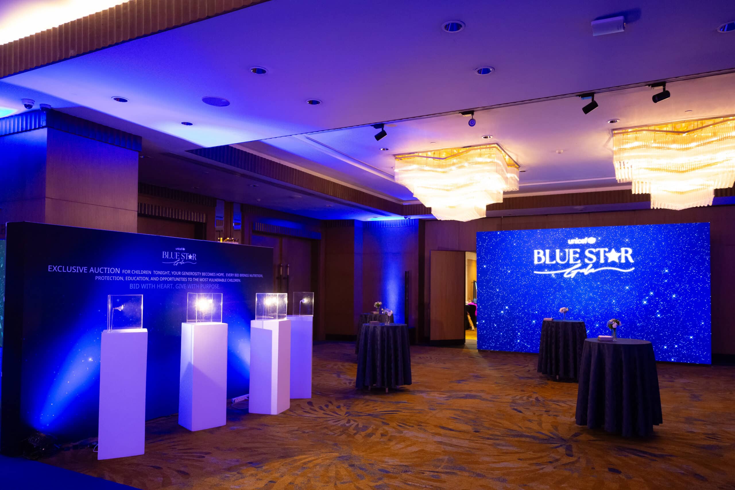 gala dinner blue lit stage at a corporate event at The Athenee Hotel Bangkok, Bangkok, Thailand — managed by Niramit Creations.