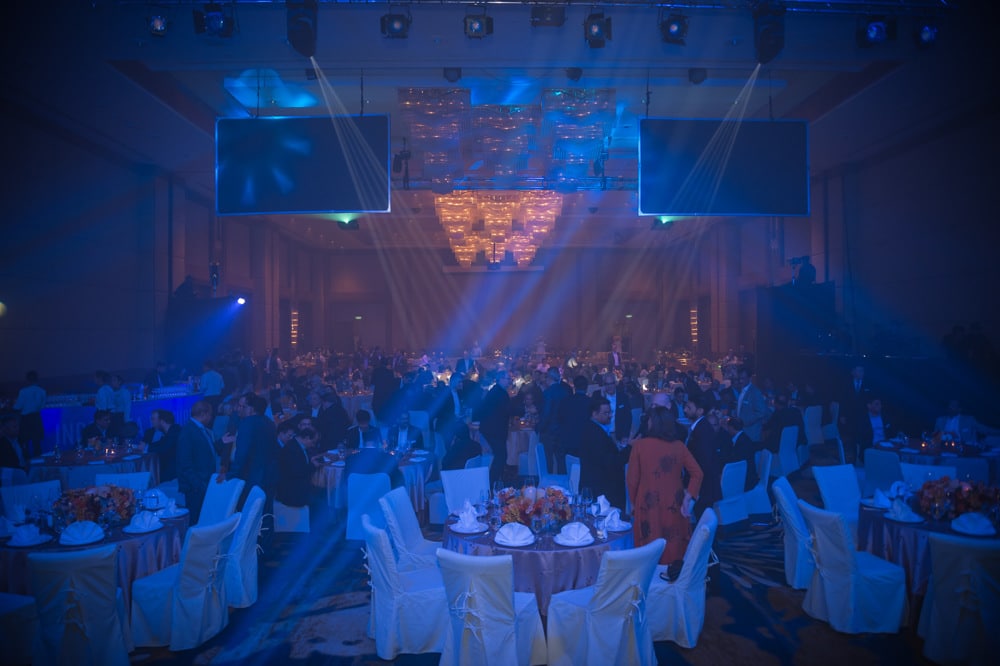 stage blue lit performance at a corporate event at The Athenee Hotel Bangkok, Bangkok, Thailand — managed by Niramit Creations.