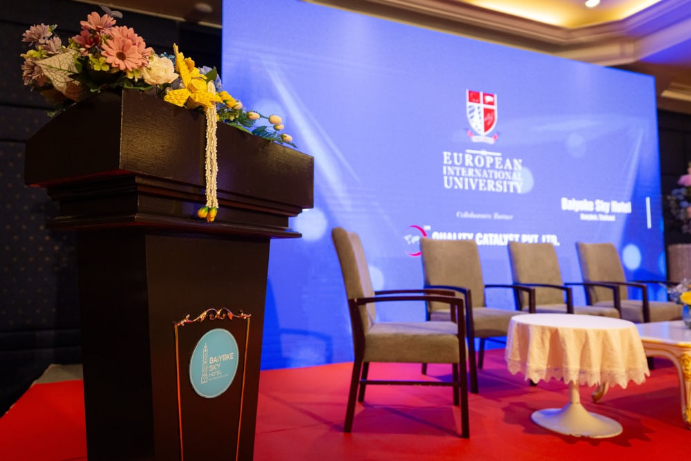 stage podium floral at a corporate event at Baiyoke Sky Hotel Bangkok, Bangkok, Thailand — managed by Niramit Creations.