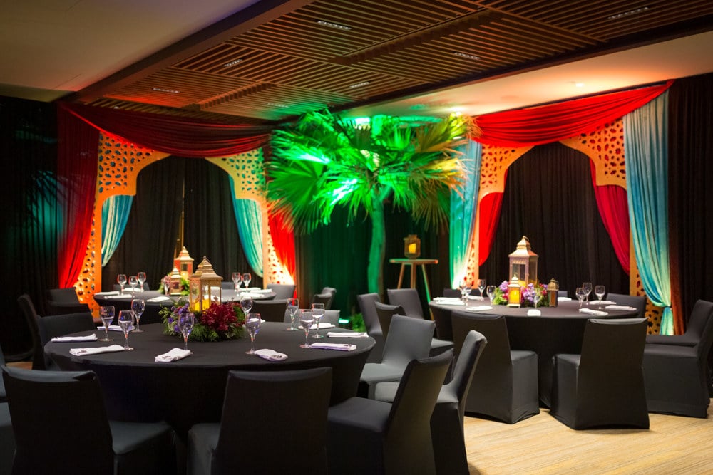 Sangeet multicolor stage night at an Indian wedding at Banyan Tree Phuket, Phuket, Thailand — planned by Niramit Creations.
