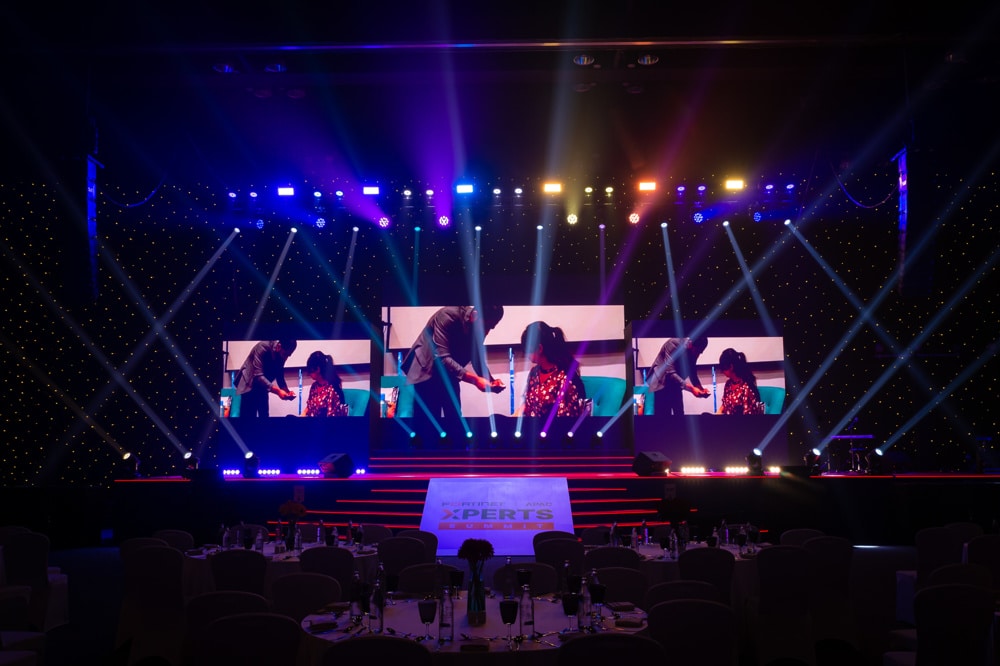 stage blue lighting at a corporate event at Centara Grand at CentralWorld Bangkok, Bangkok, Thailand — managed by Niramit Creations.