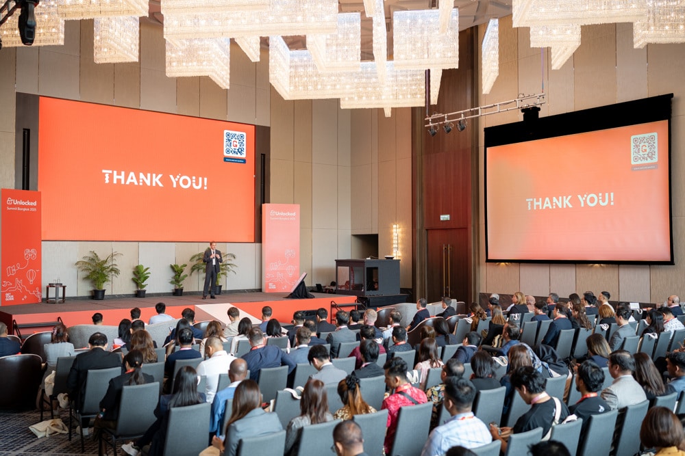 GetYourGuide Unlocked Summit corporate event summit main stage at Chatrium Grand Bangkok, planned and managed by Niramit Creations Thailand.