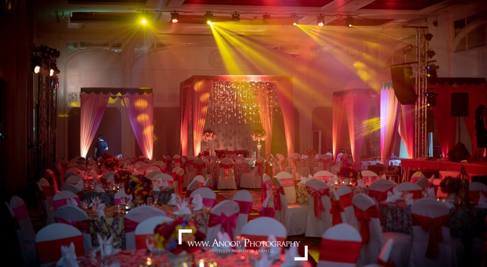 Sangeet red corridor stage at Dusit Thani Hua Hin, Hua Hin — Indian wedding planned by Niramit Creations.