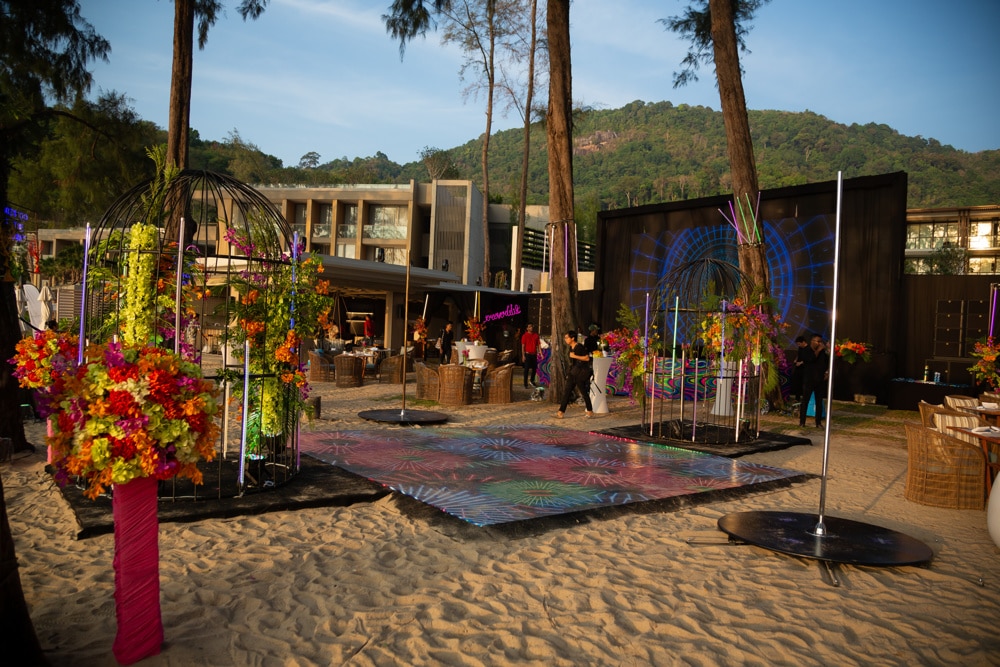 Welcome to Thailand Party colorful stage beach at an Indian wedding at InterContinental Phuket Resort, Phuket, Thailand — planned by Niramit Creations.