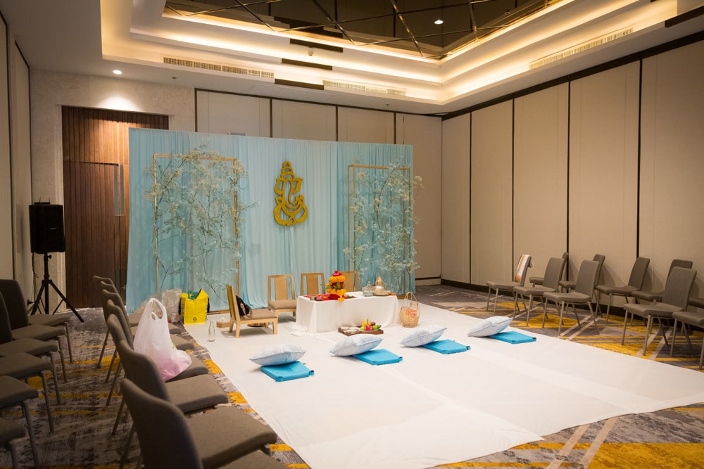 Ghari Pooja stage floral decor at an Indian wedding at JW Marriott Khao Lak Resort & Spa, Khao Lak, Thailand — planned by Niramit Creations.