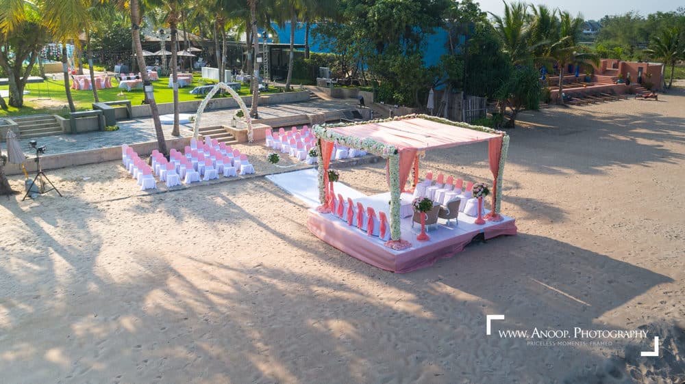 Wedding colorful beach stage at The Palayana Hua Hin, Hua Hin — Indian wedding planned by Niramit Creations.