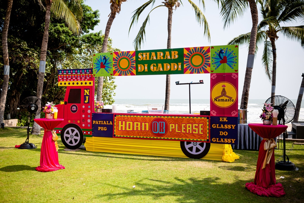 Haldi colorful truck stage at The Palayana Hua Hin, Hua Hin — Indian wedding planned by Niramit Creations.