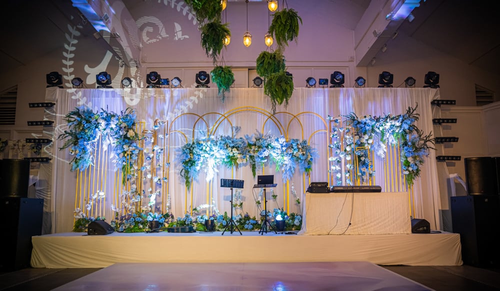 Sangeet greenery stage decor at The Regent Cha-Am Beach Resort, Cha-Am — Indian wedding planned by Niramit Creations.