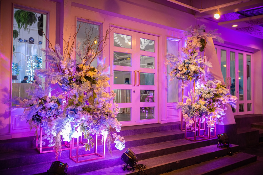 Sangeet pink floral stage at The Regent Cha-Am Beach Resort, Cha-Am — Indian wedding planned by Niramit Creations.