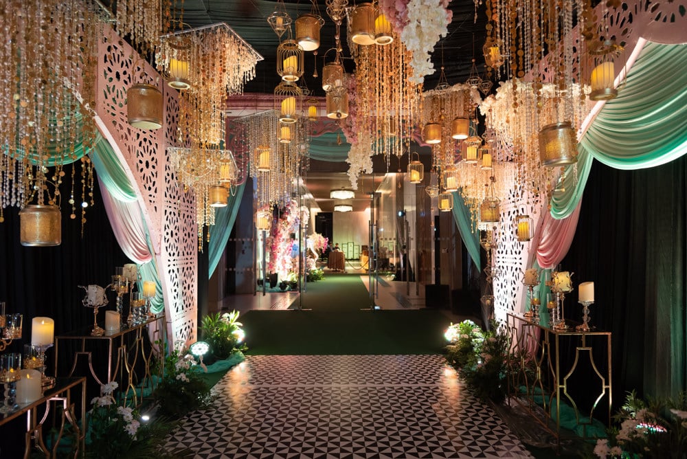 Sangeet colorful draped stage at Sheraton Hua Hin Resort & Spa, Hua Hin — Indian wedding planned by Niramit Creations.
